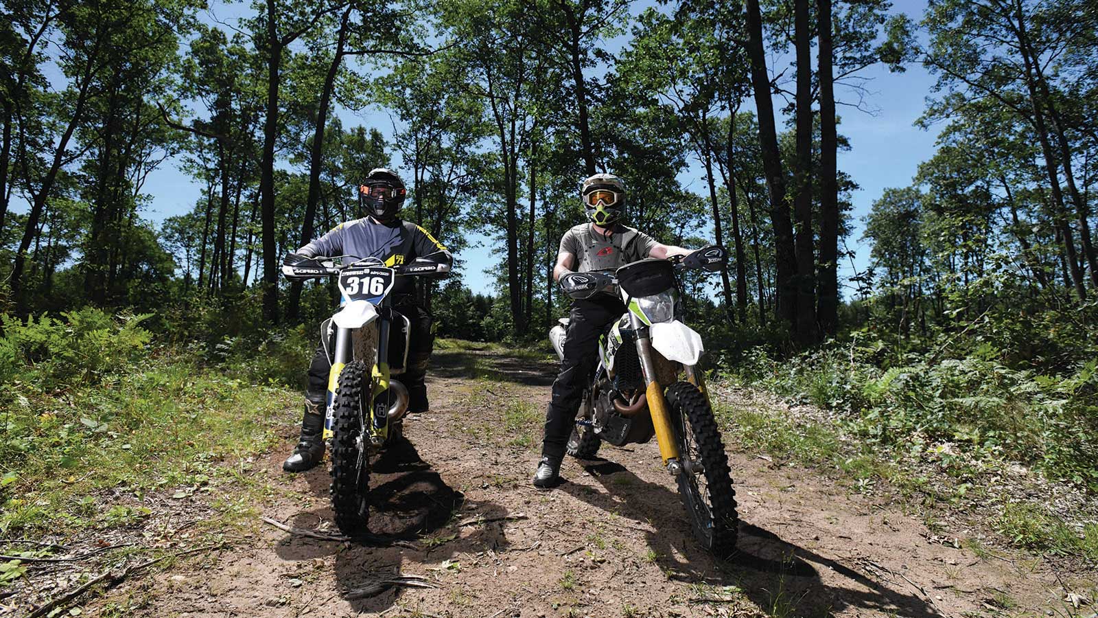 Two dirt bikers riding on Tamaracks Ohm Trail Vilas County