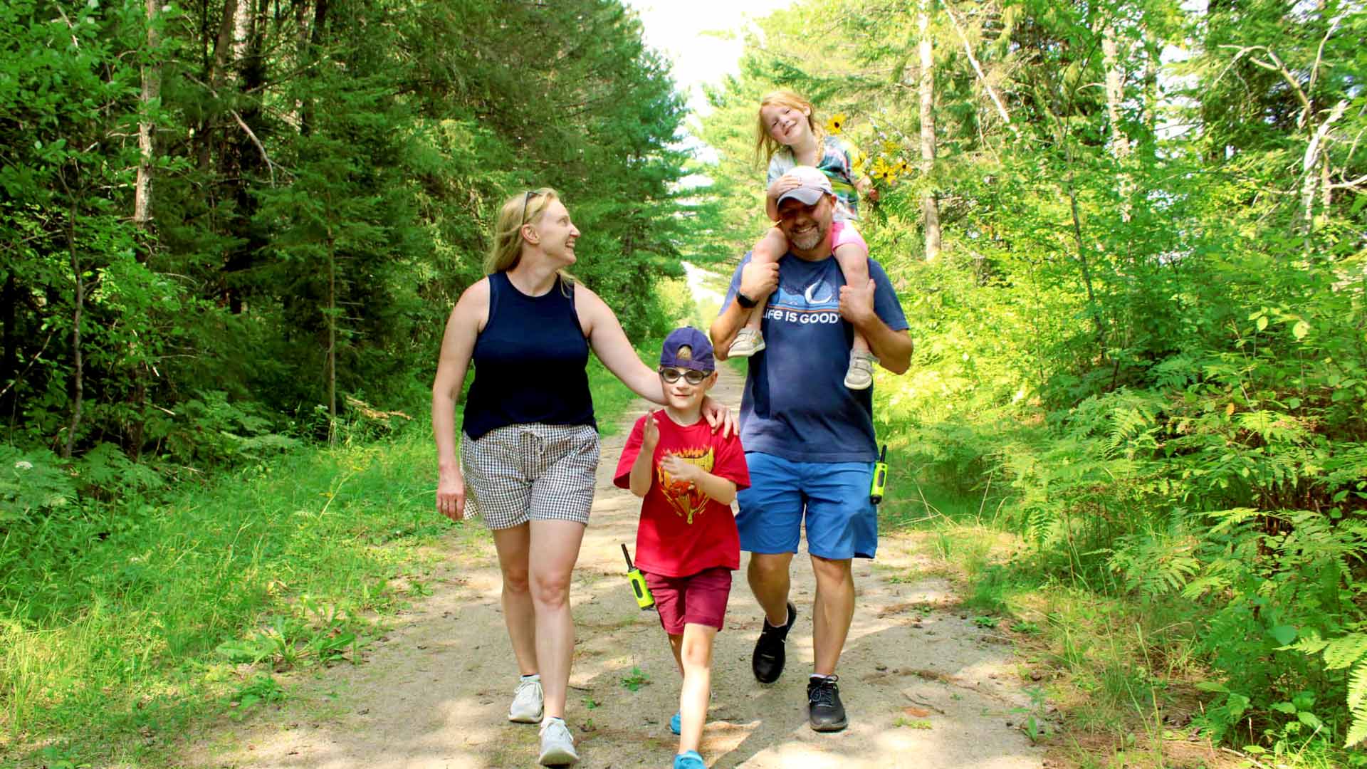Family hiking in woods in Vilas County Wisconsin