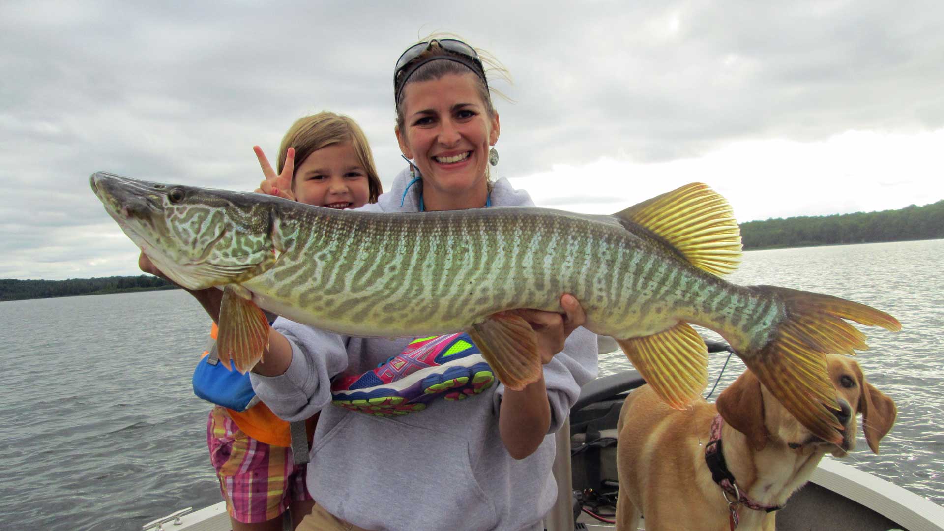 Mom and daughter holding up their catch in Vilas County