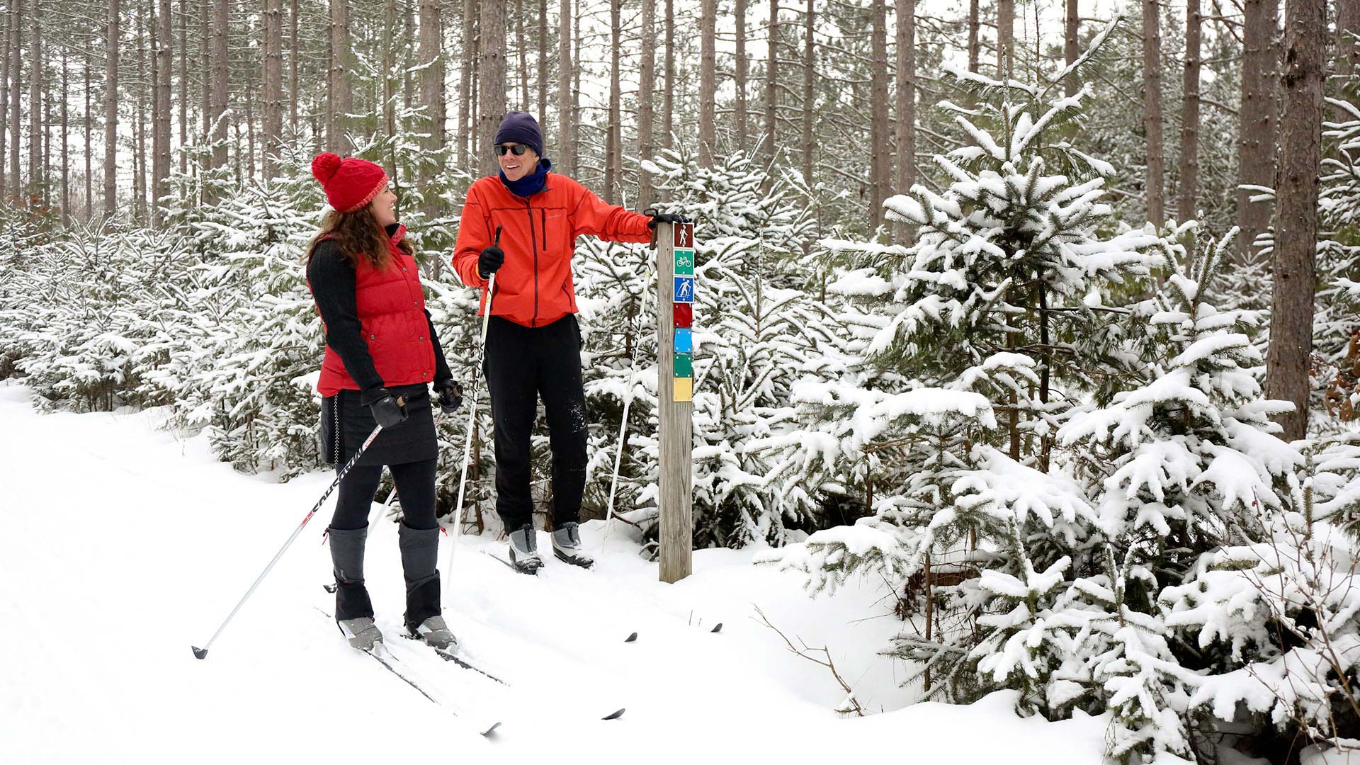 A couple cross-country skiing on Madeline Lake Trail