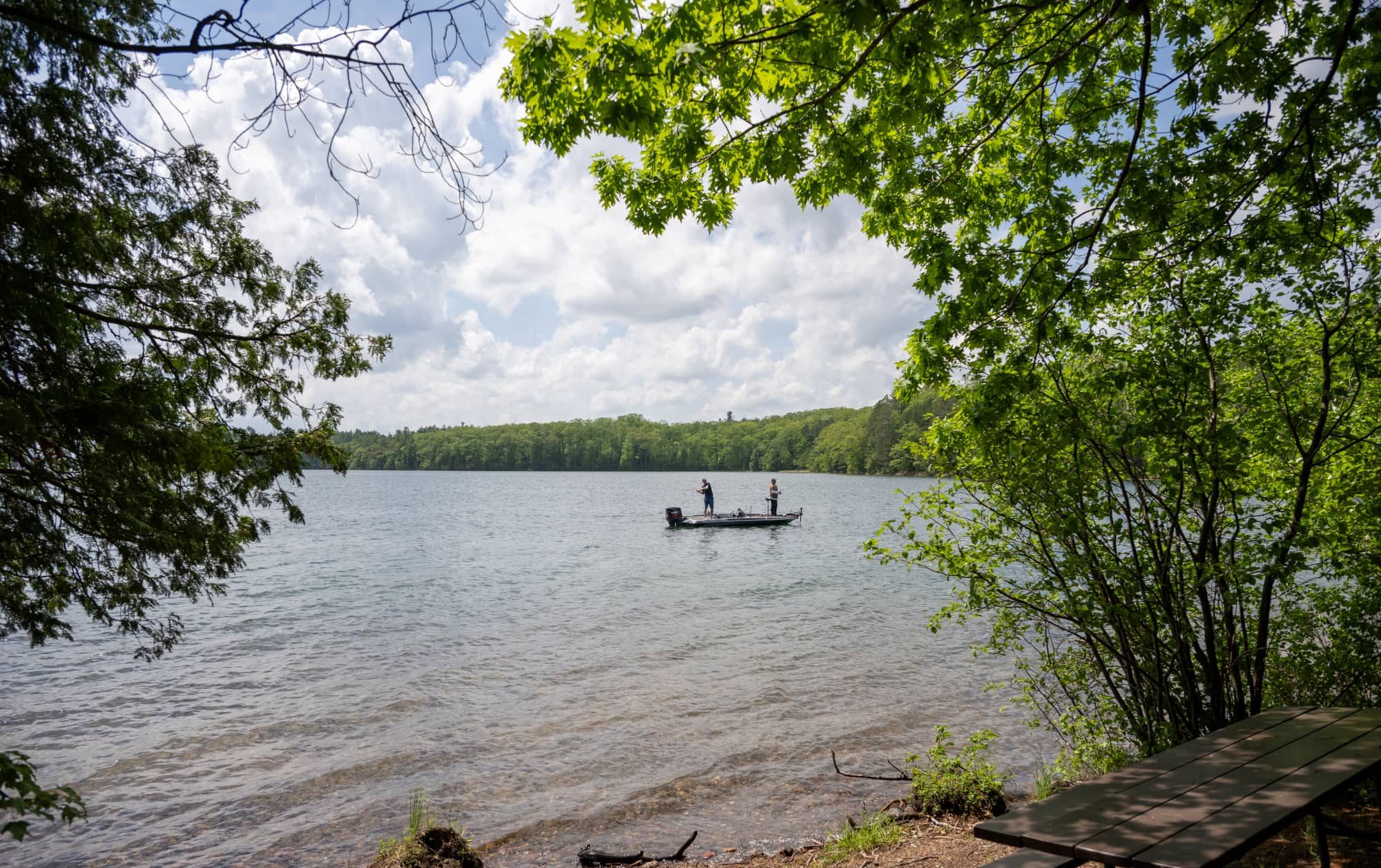 Men fishing on a boat on Trout Lake in Boulder Junction in Vilas County Wisconsin