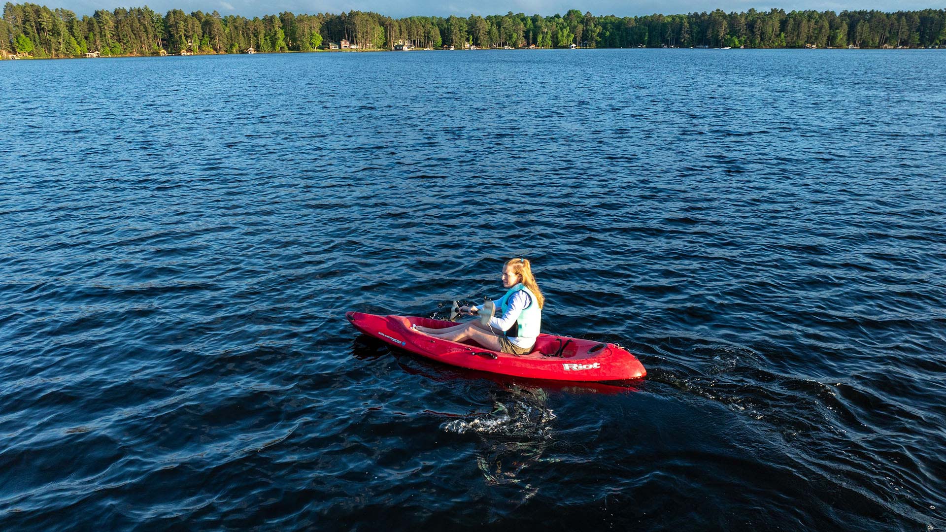 Girl paddling the waterways in Eagle River