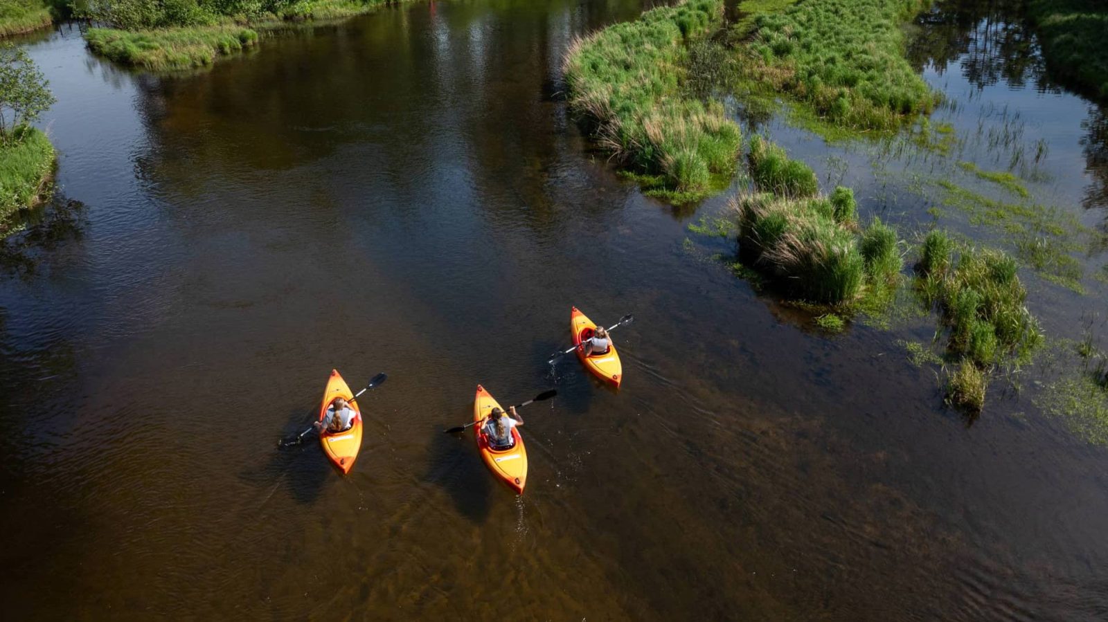 Three kayaks on the Manitowish River in Vilas County Wisconsin