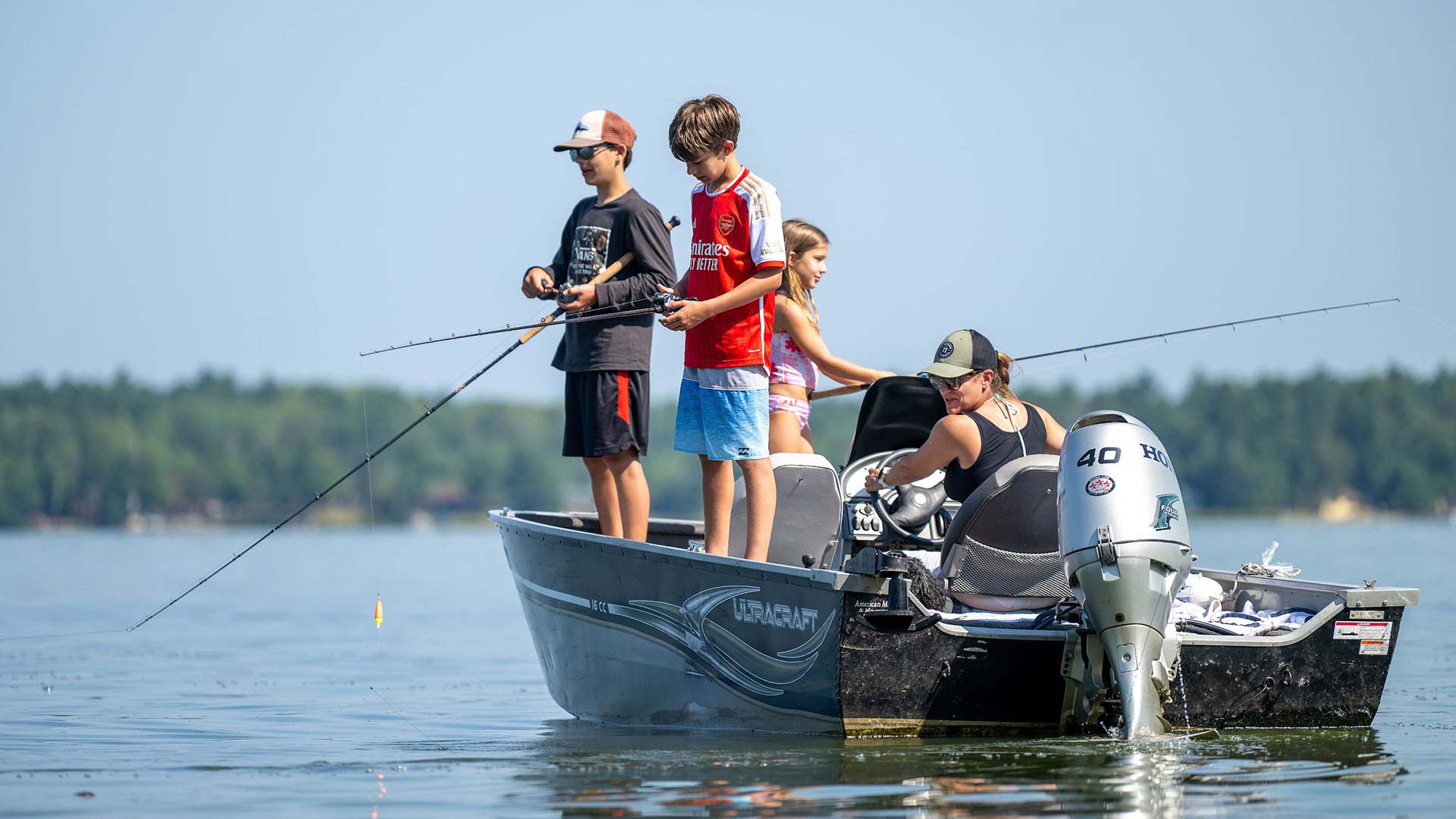 Kids fishing off of a boat at Lynn Anns Campground
