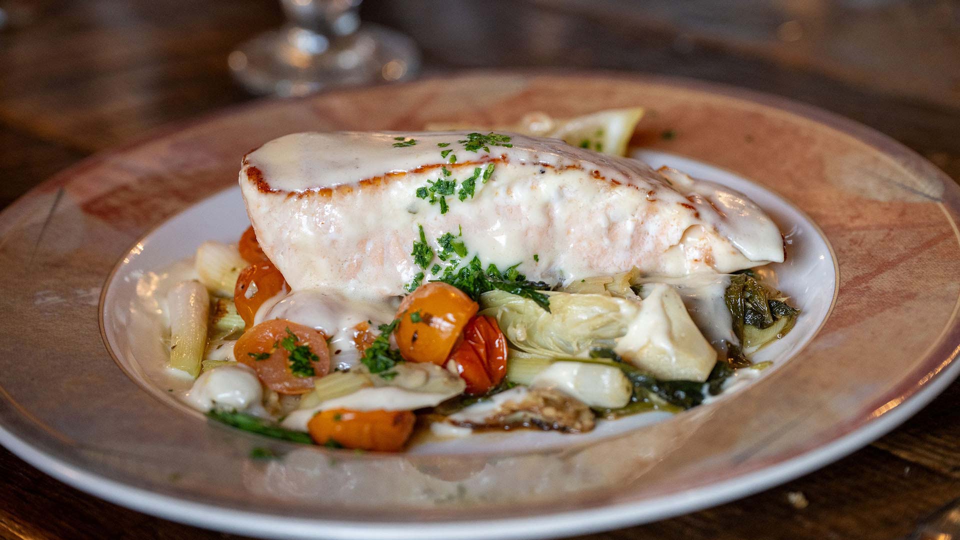 A elegantly plated fish dish at Whitetail Inn
