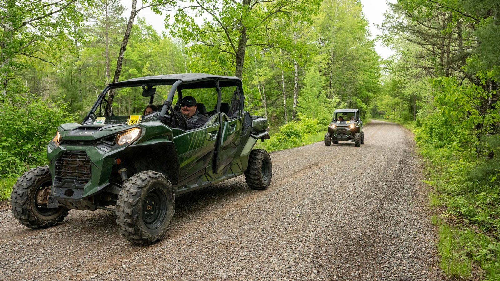 Group of UTVers riding on a gravel trail in Land O Lakes