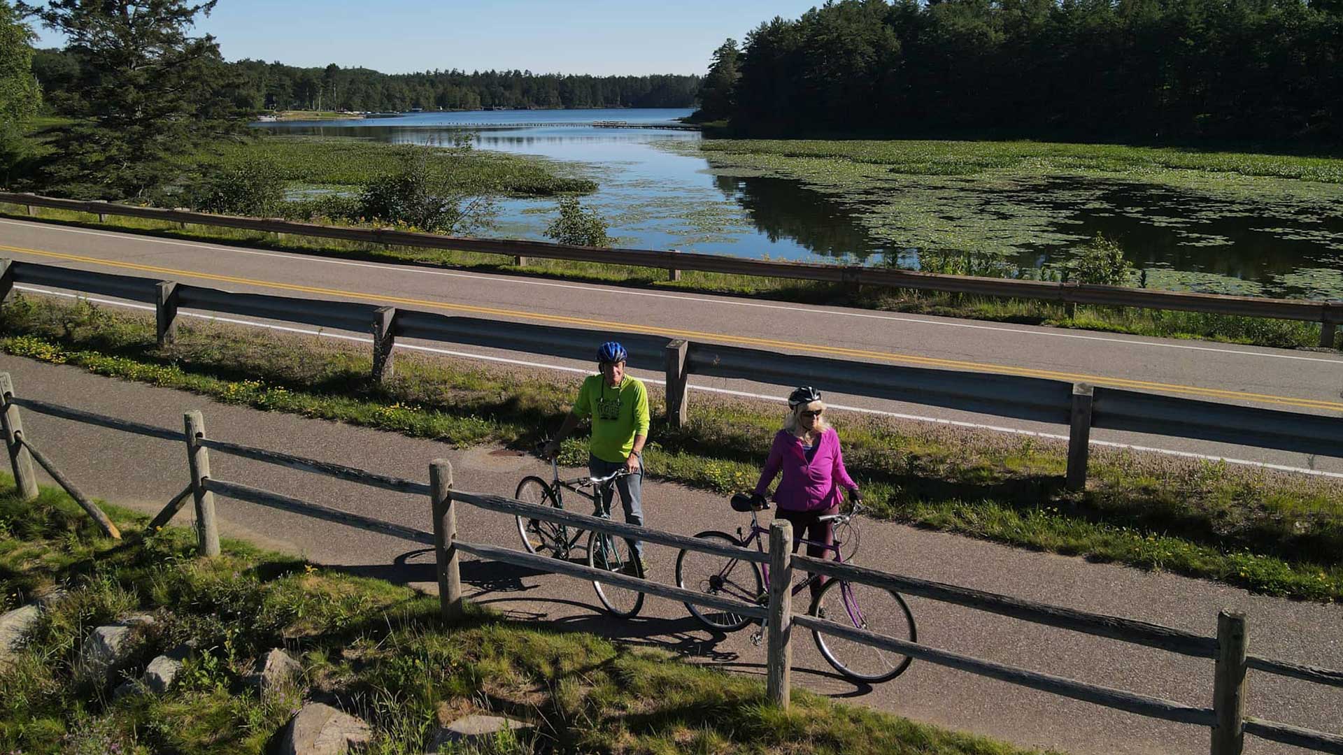 Couple with their bikes along the Heart of Vilas County Bike Trail in northern Wisconsin